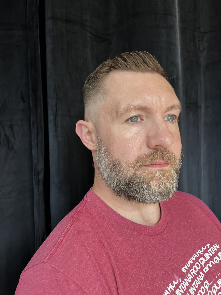 High fade slick back haircut at The Gilded Edge, West Seattle barbershop