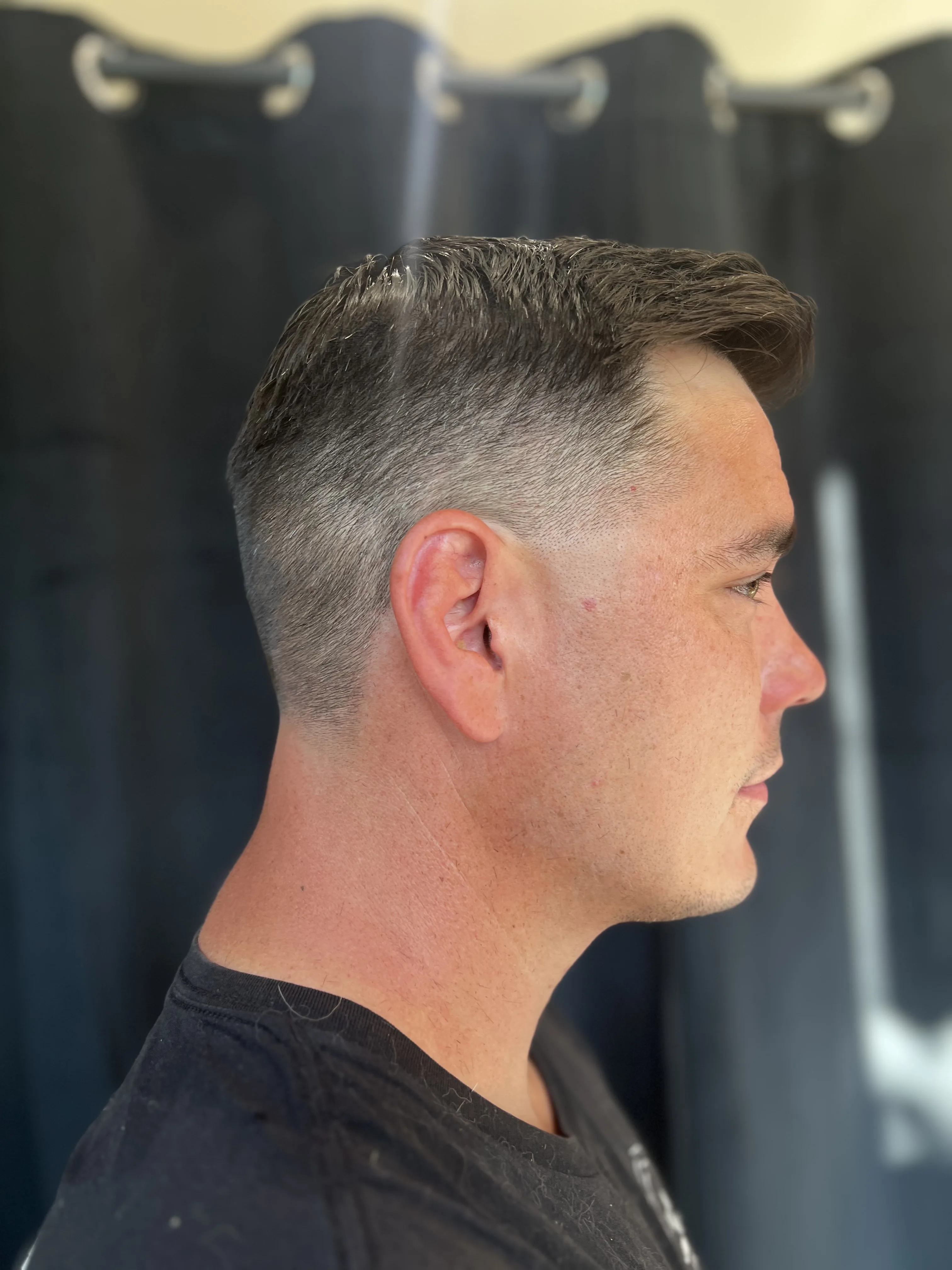 Low fade combover slick back at The Gilded Edge, West Seattle barbershop