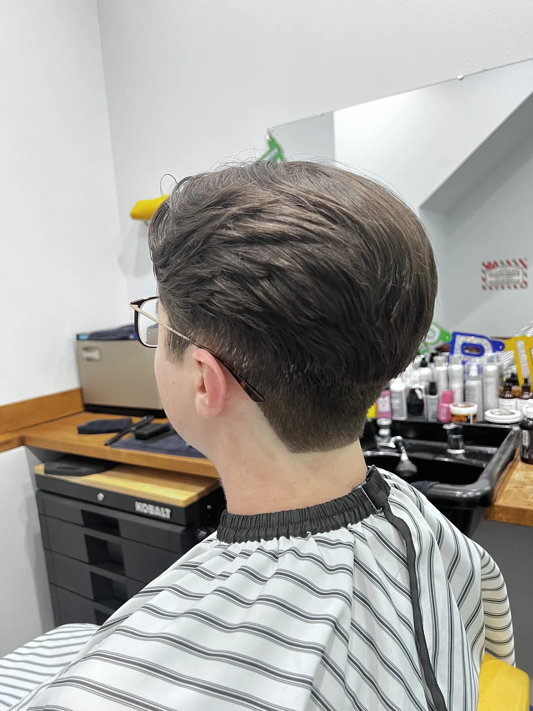 Men's taper haircut at The Gilded Edge barbershop, West Seattle
