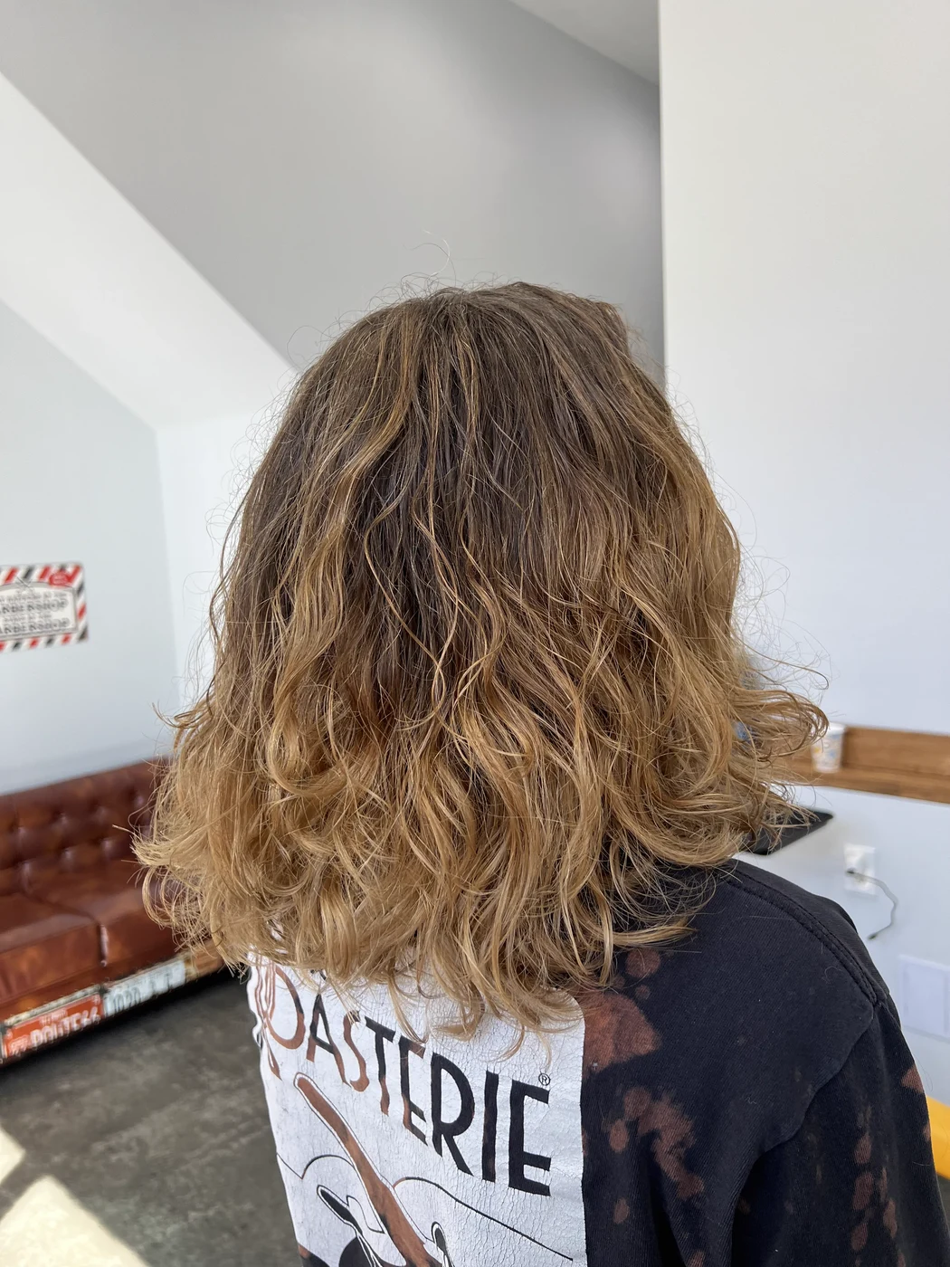 Natural wavy haircut and style at The Gilded Edge, West Seattle