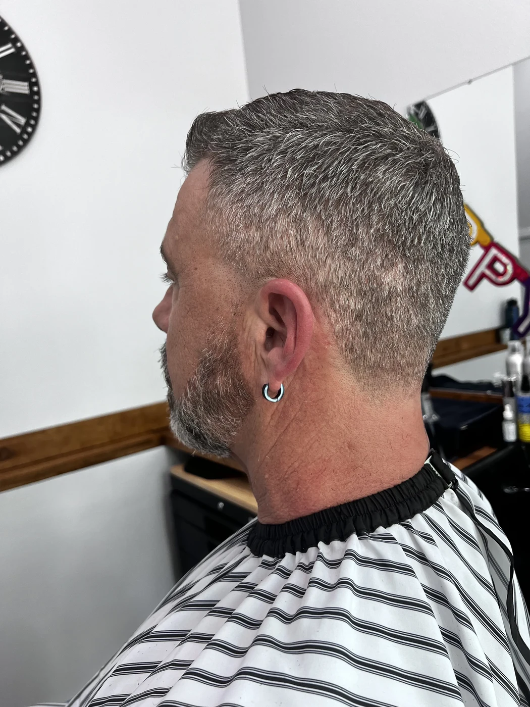 Men's silver grey crop cut at The Gilded Edge, West Seattle barbershop